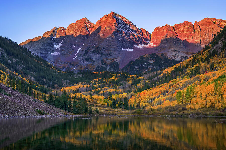 Maroon Bells sunrise with autumn aspens and Colorado mountain reflection by Dan Sproul