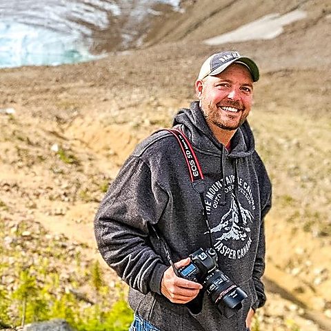 Dan Sproul — award-winning fine art photographer based in Lima, Ohio, holding Canon camera in Jasper Canada