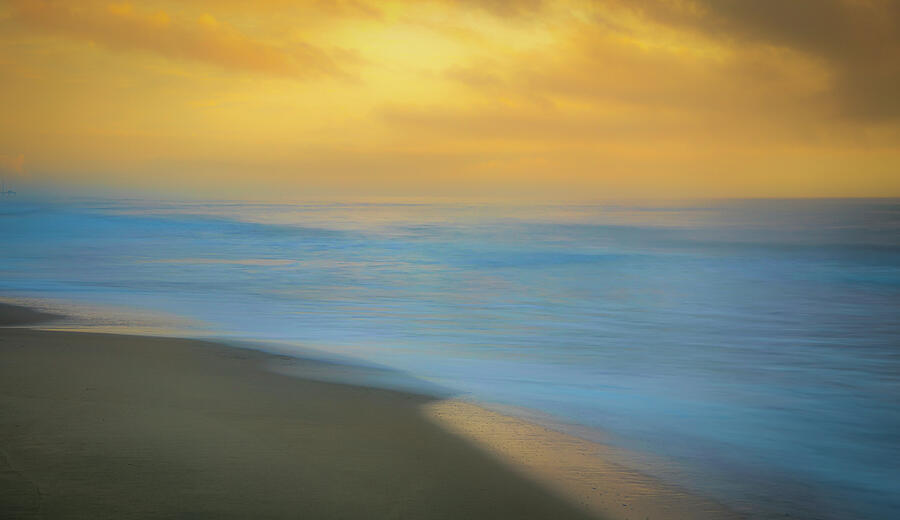 Dreamy Outer Banks beach sunrise with soft water and warm light by Dan Sproul