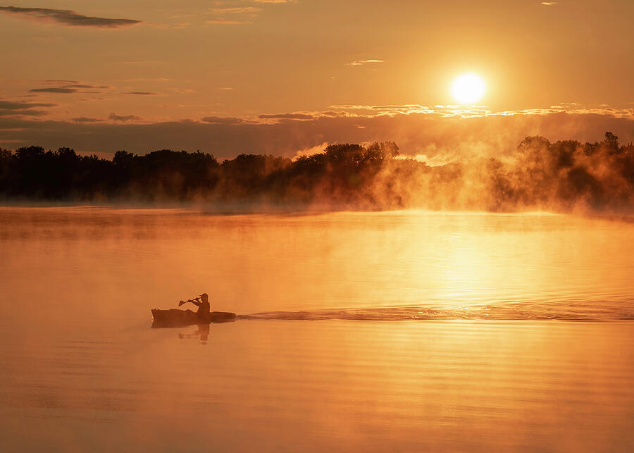 Kayaker on a misty lake at golden sunrise in Lima Ohio by Dan Sproul