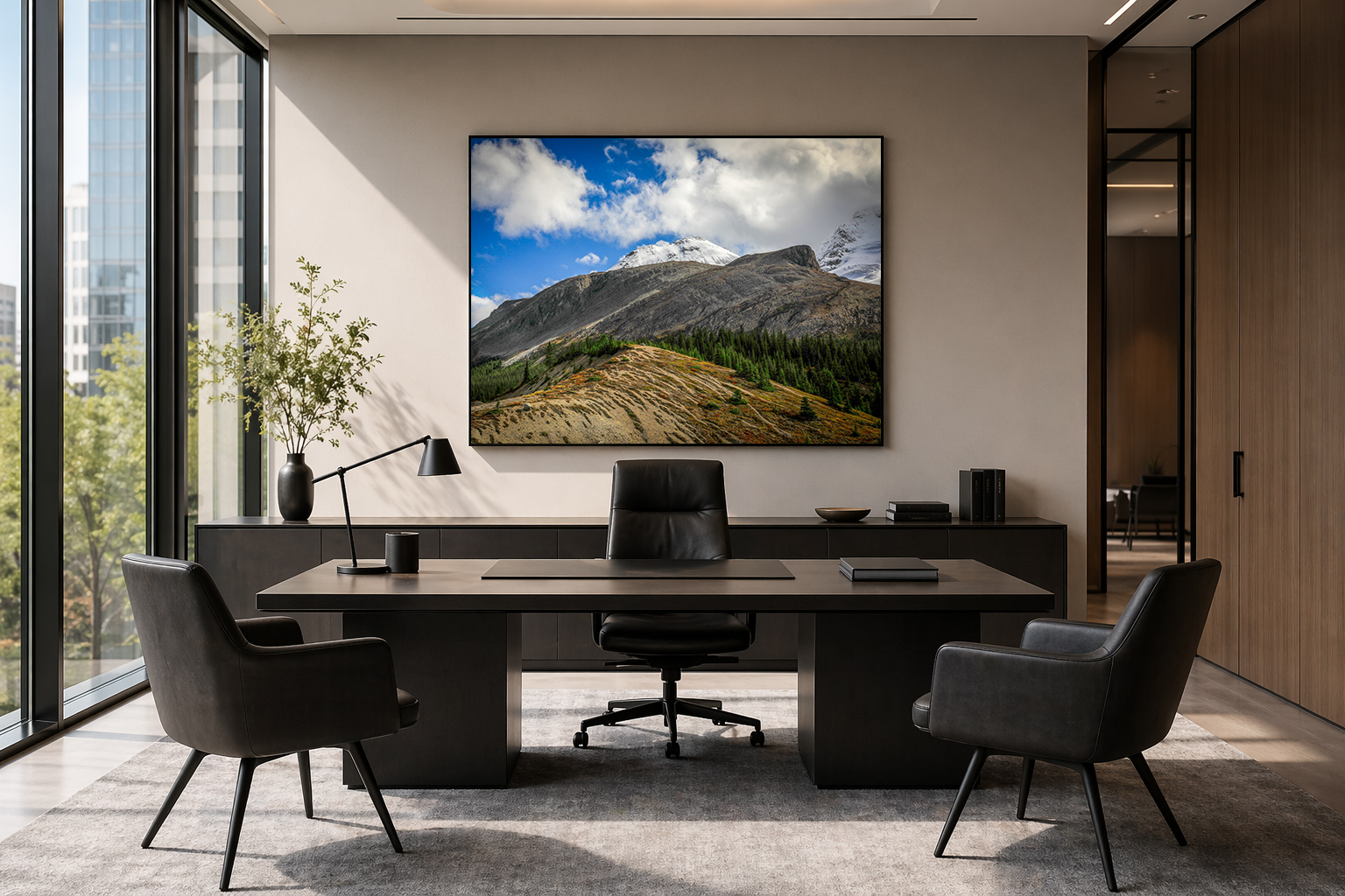 Large framed mountain print in a sunlit modern office by Dan Sproul