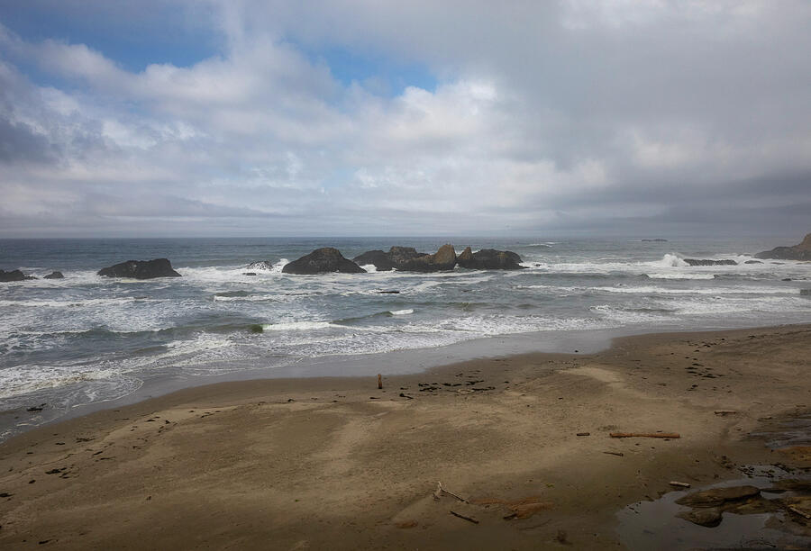 Oregon Coast sandy beach with sea stacks and Pacific Ocean waves print by Dan Sproul