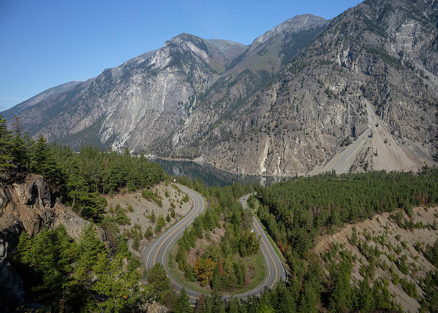 Highway 99 curving above Seton Lake through steep mountains near Lillooet British Columbia