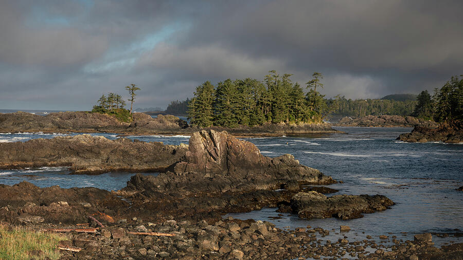 Storm light over rocky coastline along the Wild Pacific Trail in Ucluelet British Columbia photographed by Dan Sproul